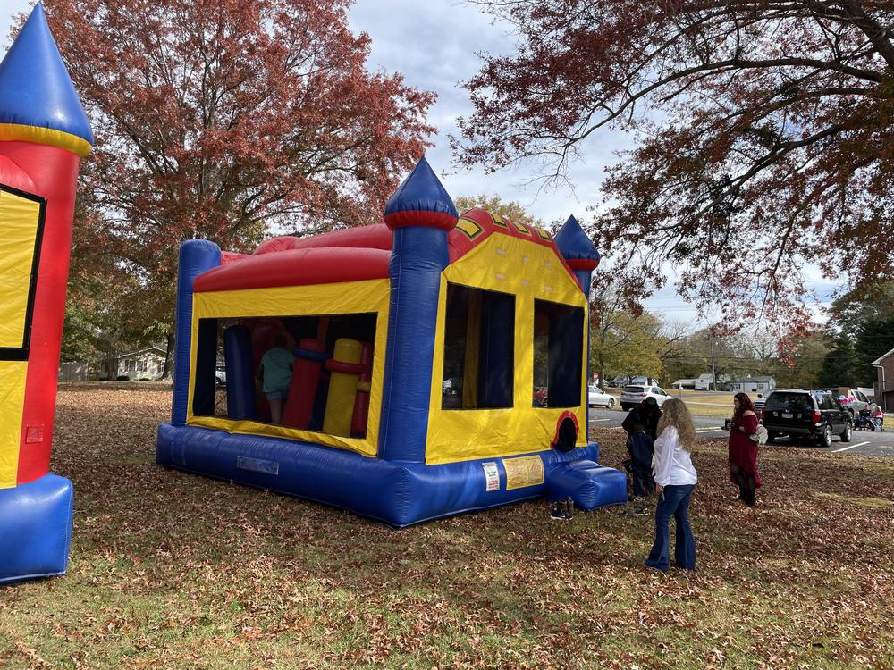 A bounce house on the lawn at a past Front Porch Fall Festival