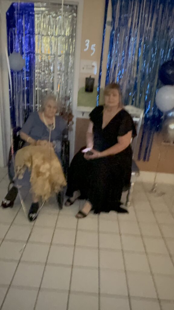 A resident and a guest dressed up at a Front Porch celebration