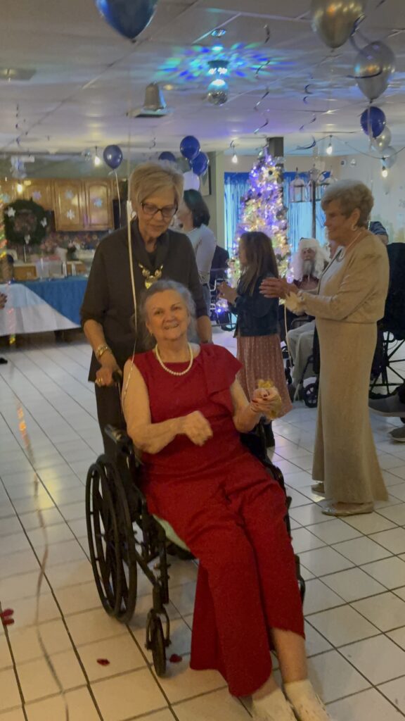 A resident dressed up in red at a Front Porch celebration